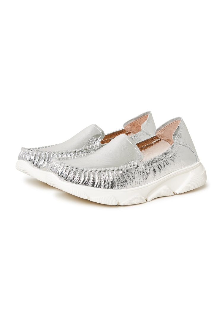 A stylish pair of silver leather platform moccasins known as Alisa moccasins.