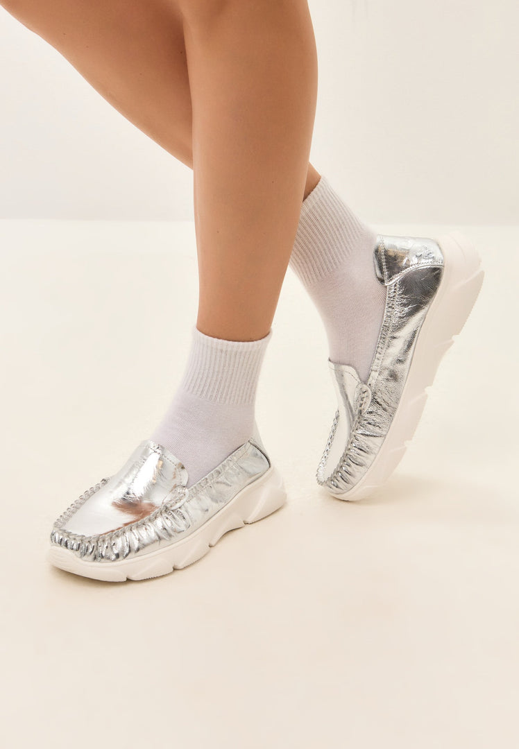 A stylish pair of Alisa silver leather platform moccasins, perfect for any occasion.