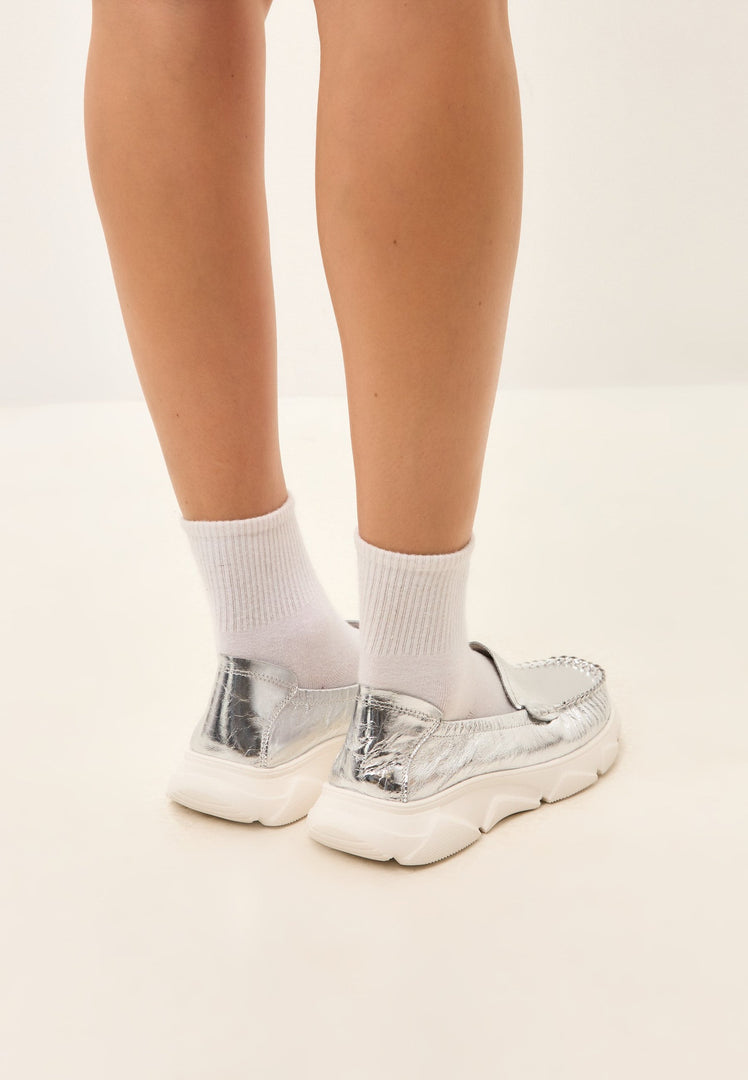A stylish pair of Alisa silver leather platform moccasins, perfect for adding a touch of elegance to your look.