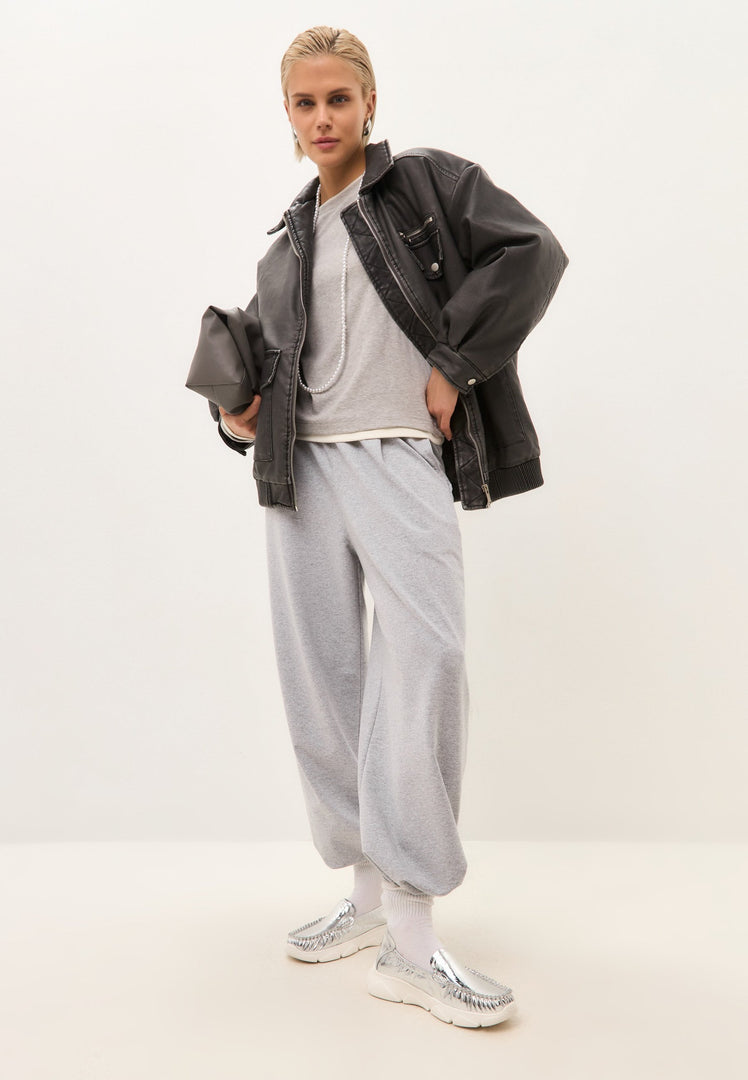 A stylish pair of silver leather platform moccasins known as the Alisa shoes.