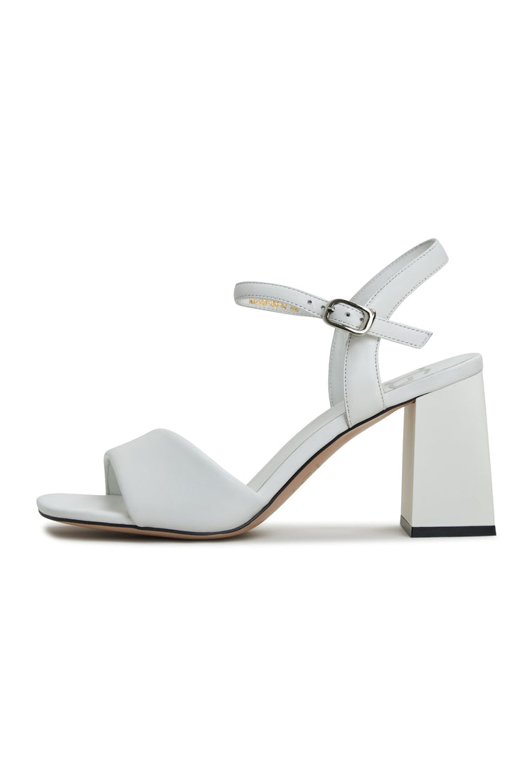 A pair of stylish and comfortable women's white block heel sandals, featuring the Aina block heel design.