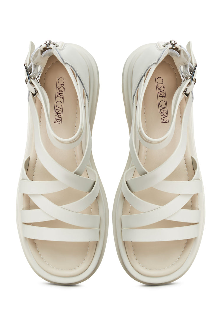 A fashionable pair of white platform sandals for women, featuring the Tatiana design with strappy details and wedge heels.