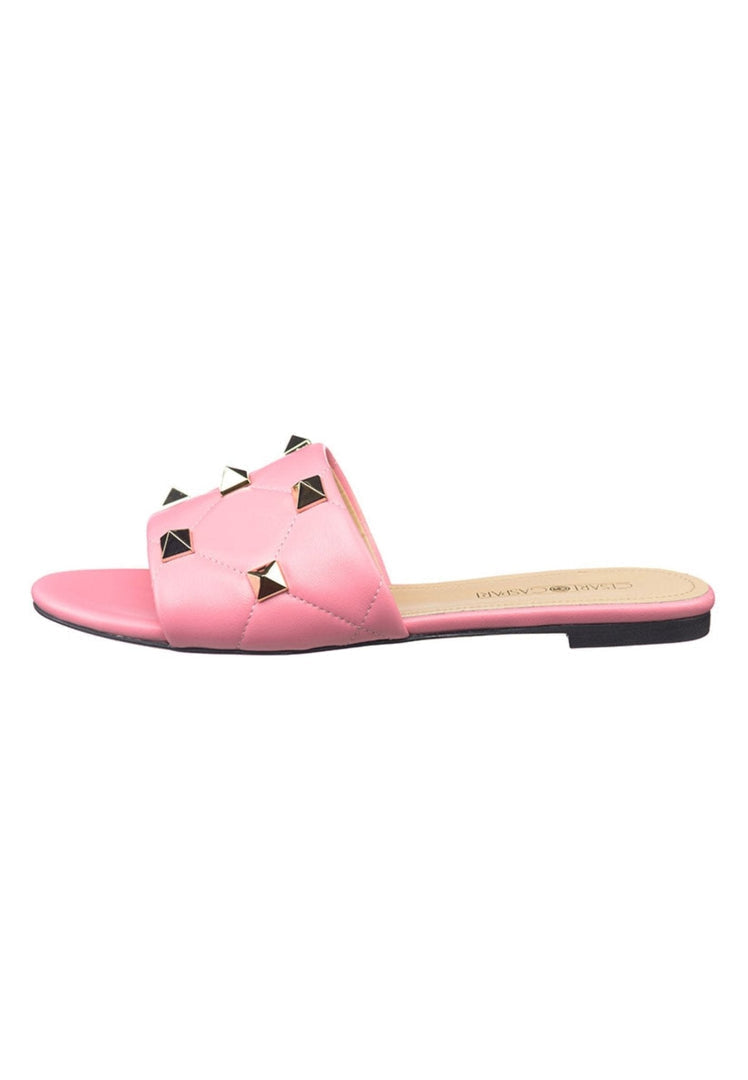 A fashionable pair of pink Rockstud sandals, known as the Mila sandals, which are designer shoes featuring edgy stud detailing.