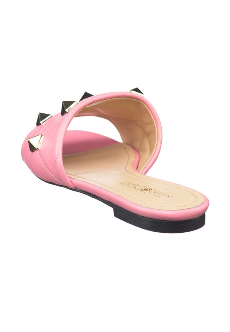 A pair of stunning pink Mila Rockstud sandals - the ultimate designer shoes for a glamorous summer look.