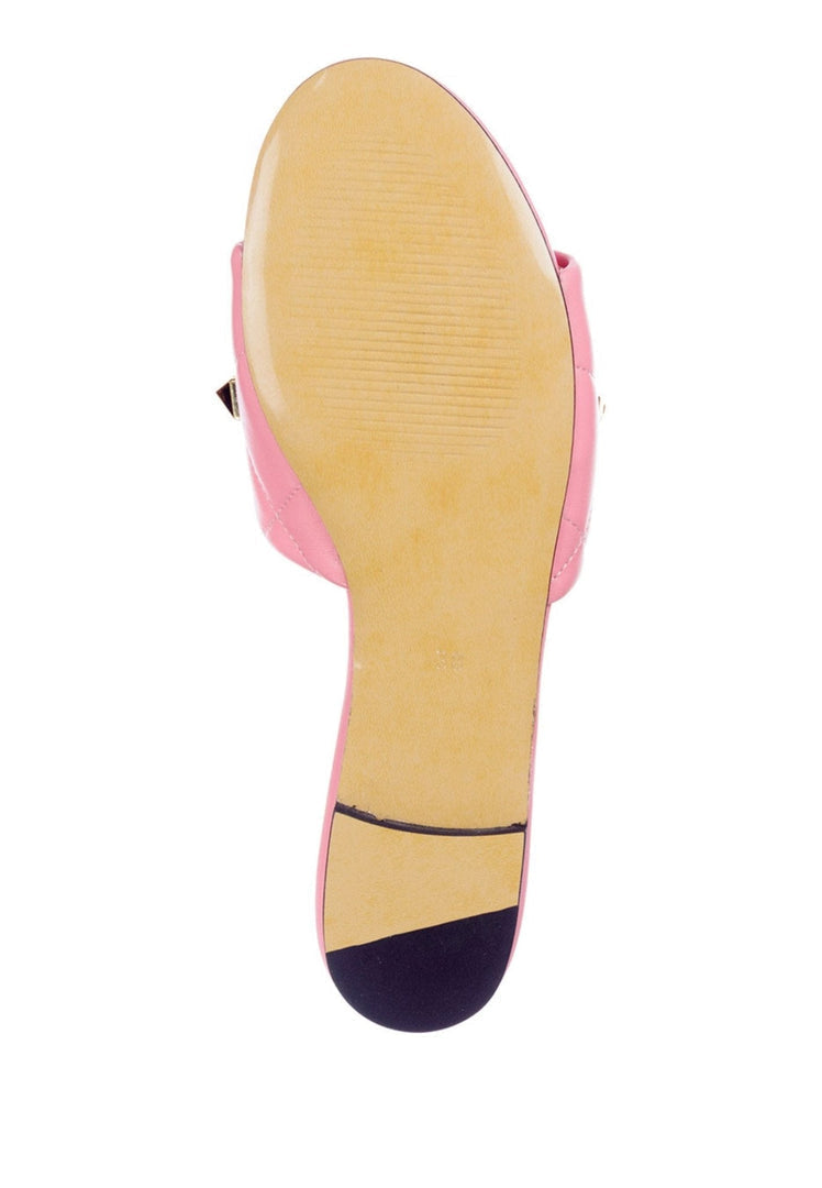 A stylish pair of designer pink Rockstud sandals, also known as Mila sandals, featuring signature studded details for a chic and trendy look.