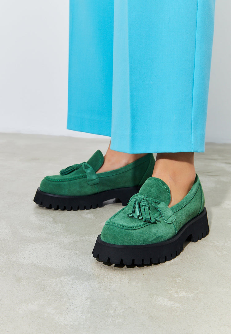A stylish pair of green Ksenia platform loafers, perfect for any woman's footwear collection.