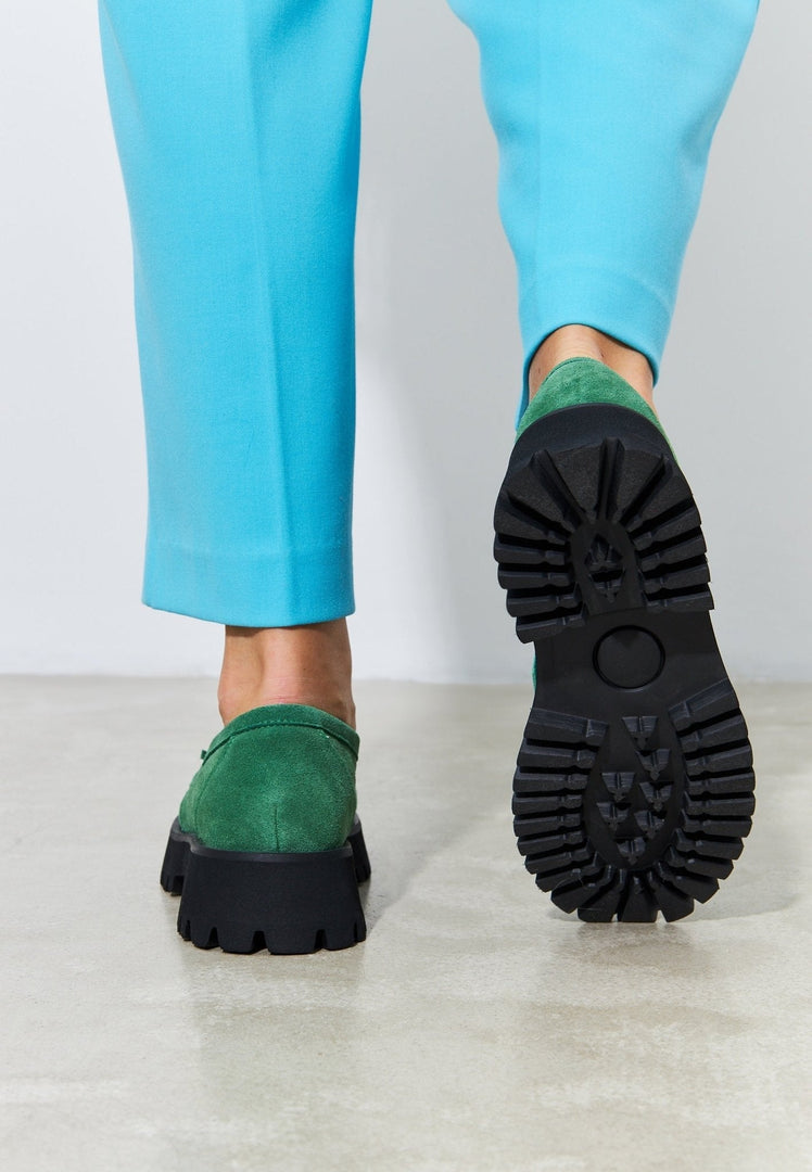 A stylish pair of green Ksenia platform loafers, perfect for any fashionable woman's footwear collection.