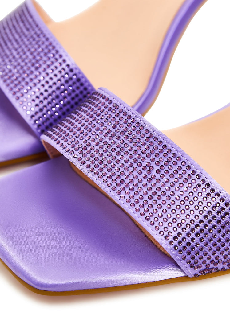 A pair of lilac strappy block heel sandals with rhinestone embellishments, perfect for women's evening wear.