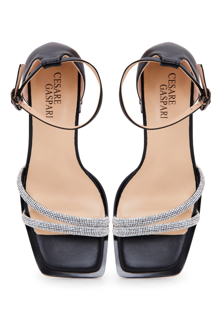 Stylish black leather block heel sandals with an open toe design, perfect for a chic and comfortable look.