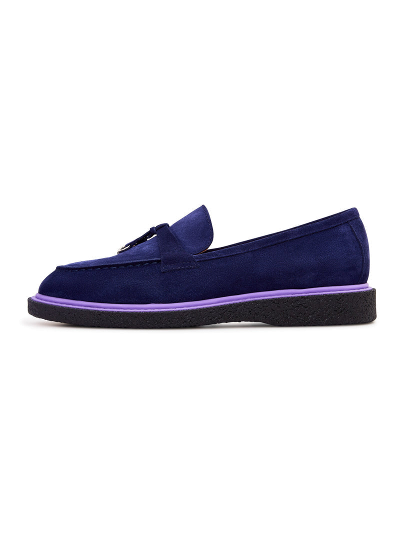 A stylish pair of navy blue suede slip-on loafers for men.