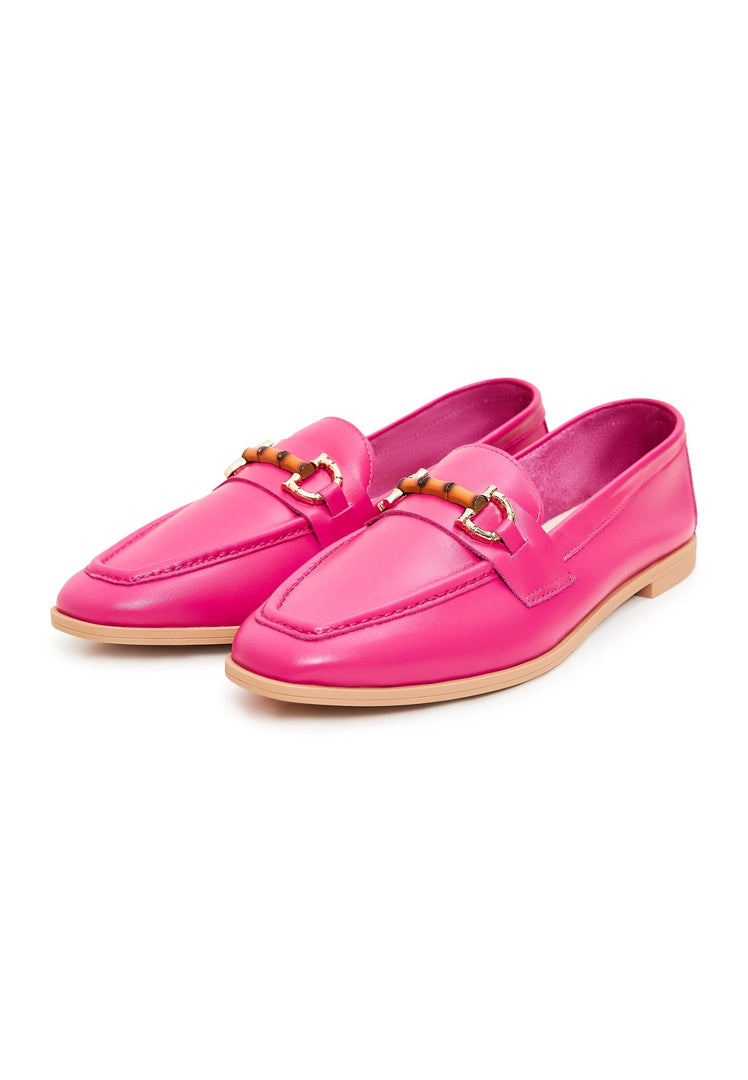 A pair of high quality leather loafers in bright fuchsia color, showcasing premium craftsmanship and luxury design.