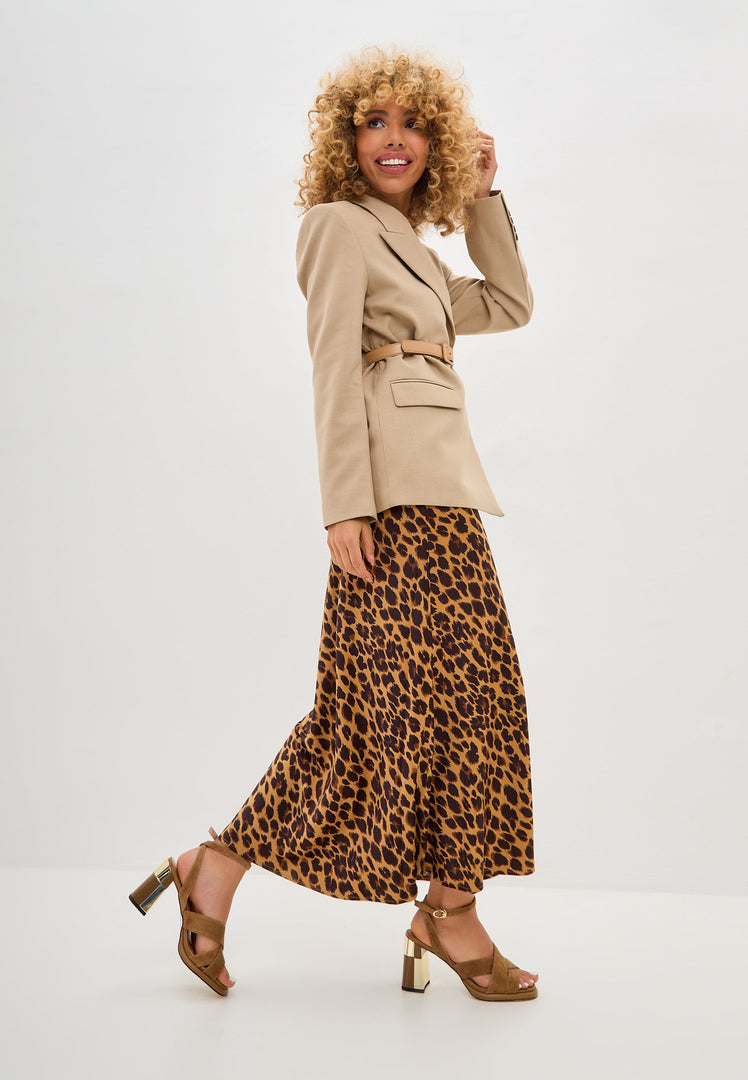 A stylish pair of beige block heeled Evelyn sandals for women, perfect for the latest fashion trends.
