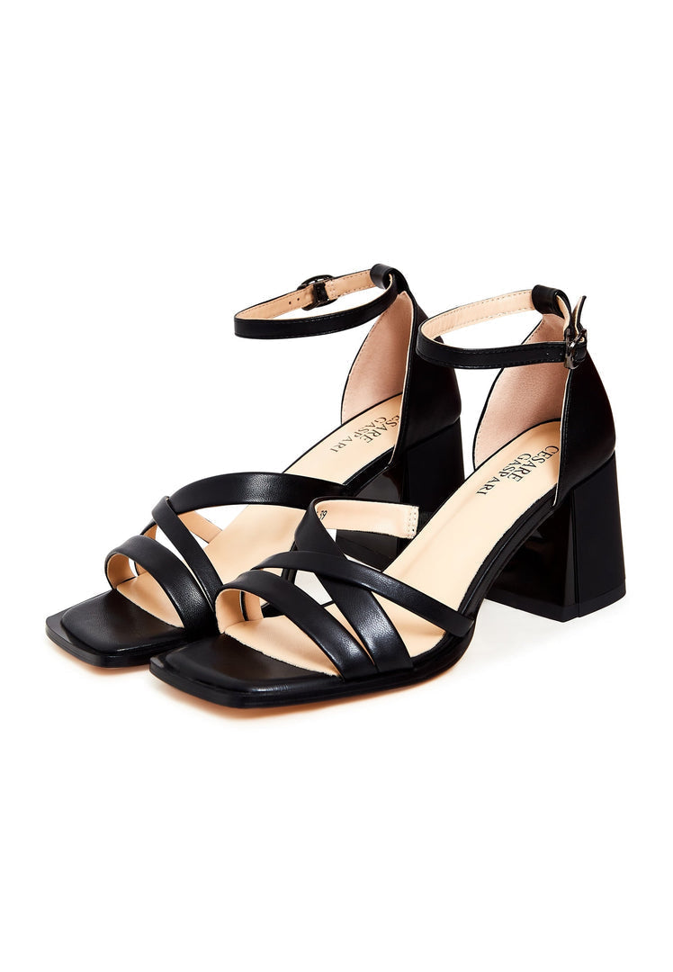 A stylish pair of women's black leather block heel open toe sandals - perfect for fashionable summer looks.