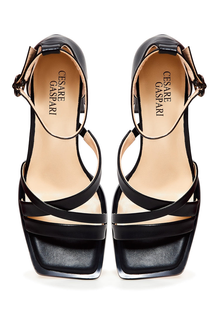 A stylish pair of open toe black leather block heel sandals, ideal for women's footwear fashion.
