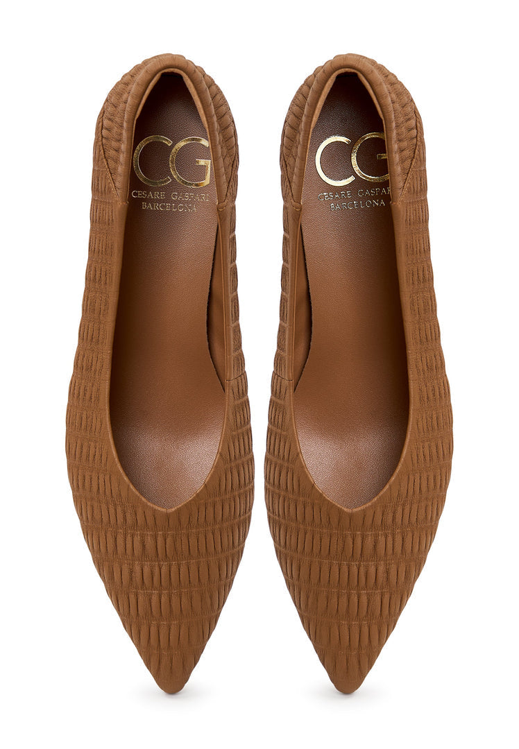 A pair of stylish brown stiletto heels, also known as pumps, named Carol, perfect for women's fashion.