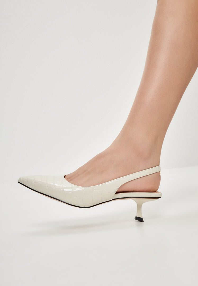 A stylish pair of stiletto heels pumps in off white, perfect for women's footwear fashion.