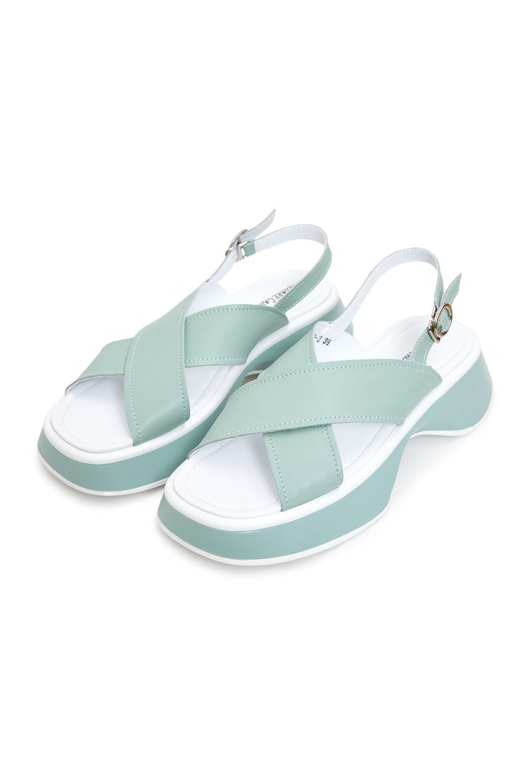 A stylish pair of green leather platform Tuti sandals, perfect for summer outings, in a feminine and chic design for women.