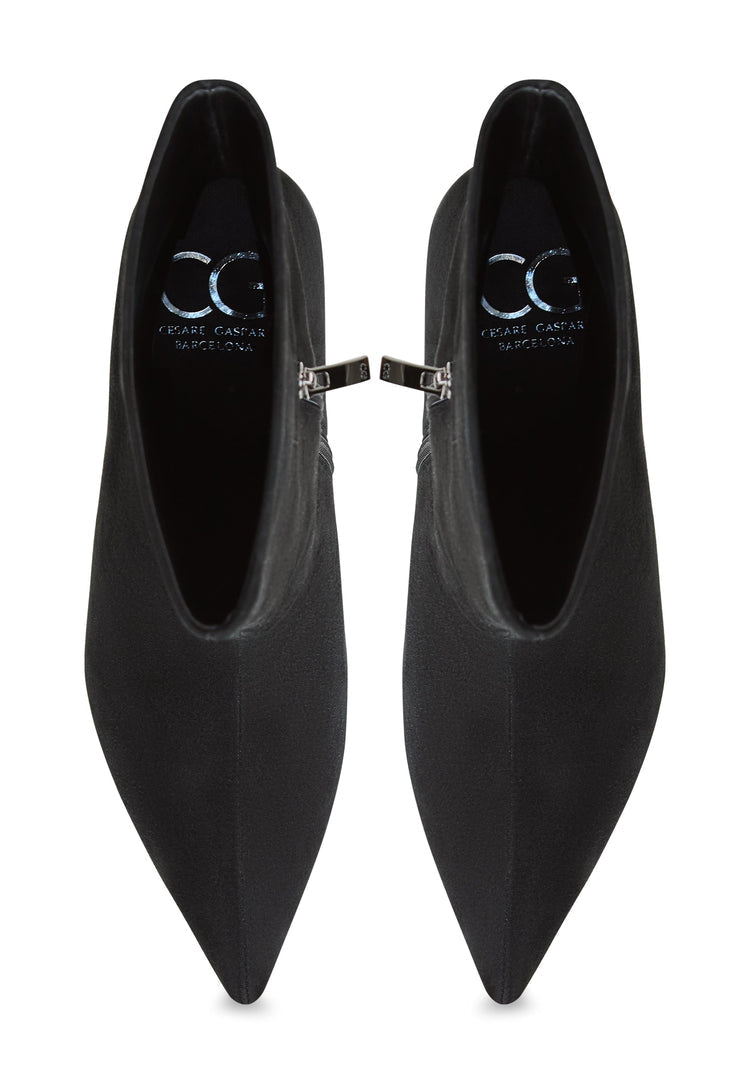 A stylish pair of black leather Regina ankle boots for women, classic and versatile must-have footwear.
