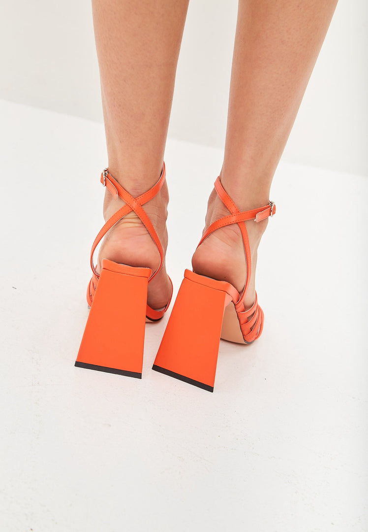 A pair of stylish orange women's chunky comfort sandals, ideal for all-day wear.