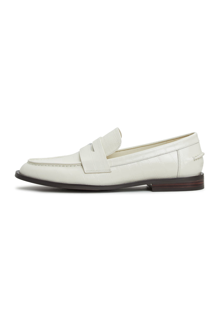 A stylish pair of white leather block heeled loafers, perfect for any fashionable woman's footwear collection.