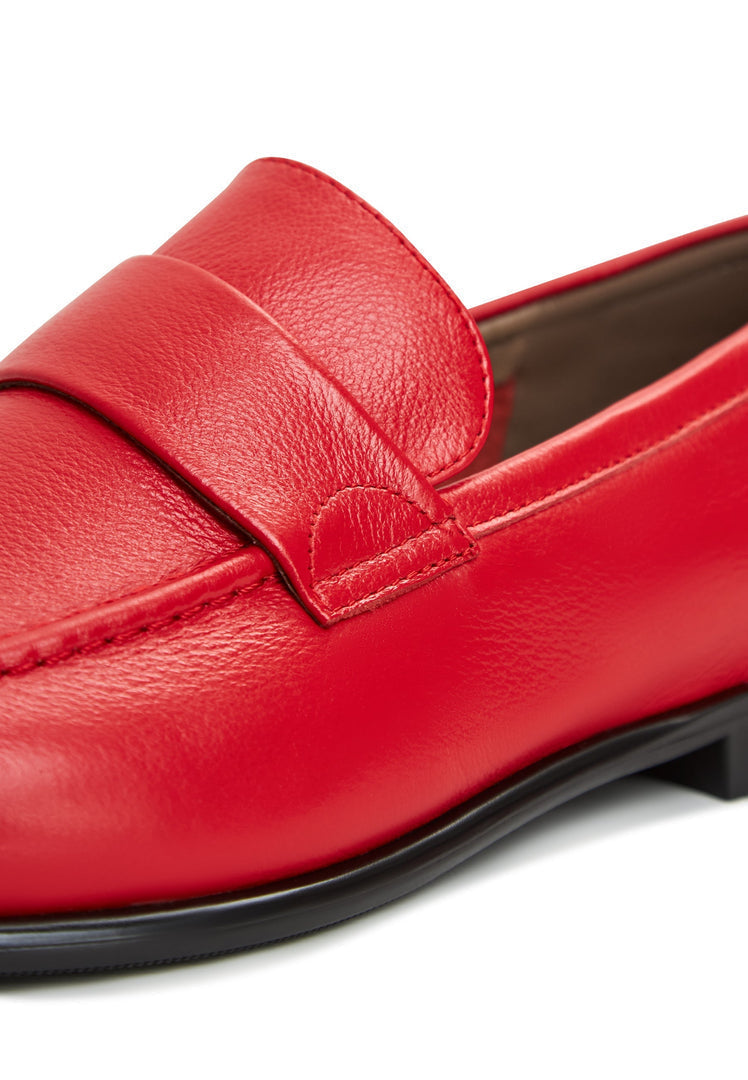 A stylish pair of red Abigail loafers with a block heel, perfect for a chic and trendy look.