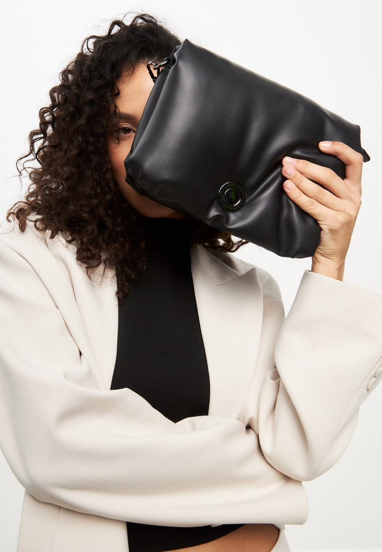 A stylish black quilted clutch bag, perfect for a night out or special occasions.