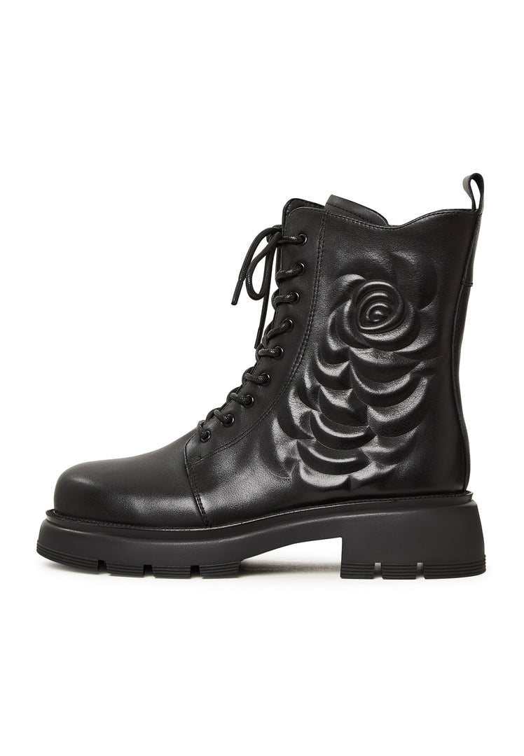 A stylish pair of black leather platform ankle boots for women, featuring a high heel and a fashionable design.