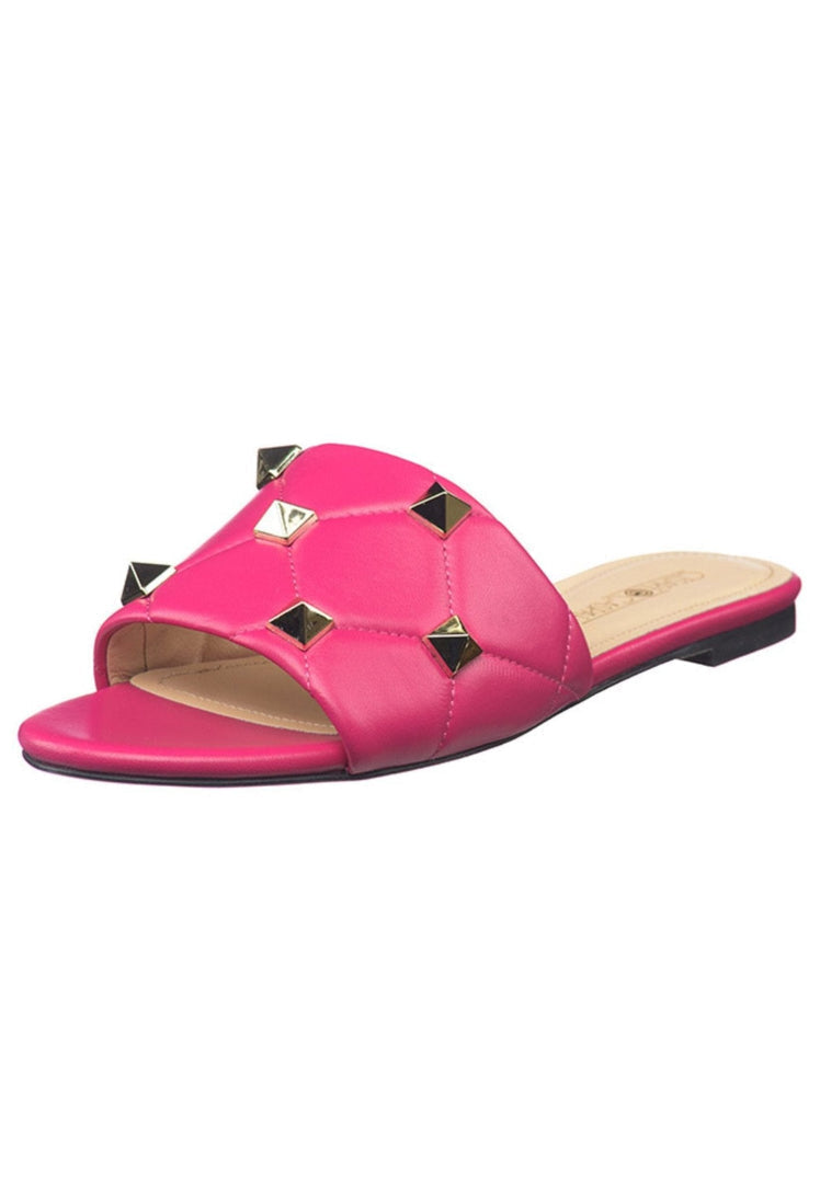 A stylish pair of fuchsia Rockstud sandals, perfect for adding a pop of color to any outfit.