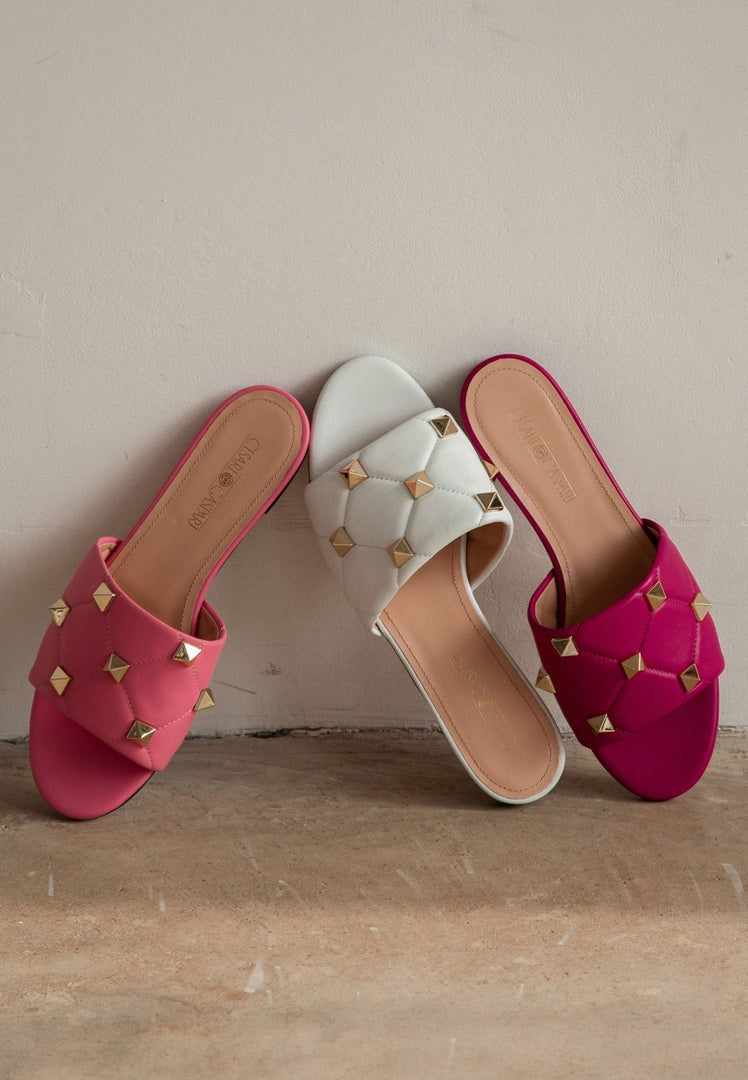 A stylish pair of designer Rockstud fuchsia sandals, featuring the elegant Mila design.