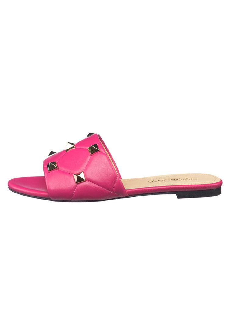 A stylish pair of designer Rockstud fuchsia sandals, featuring the trendy Mila design with eye-catching fuchsia hue and signature rockstud embellishments.