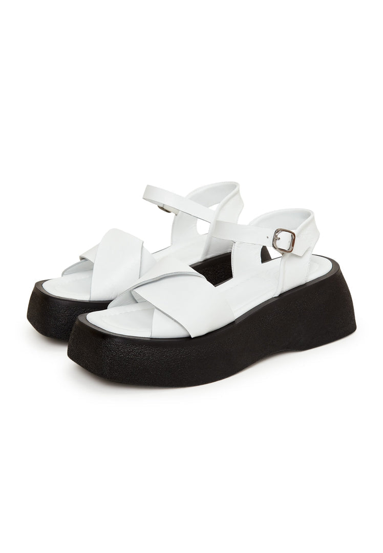 A trendy pair of white leather platform sandals, perfect for stepping into summer in style.