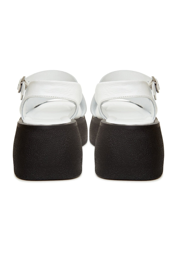 A stylish pair of white leather platform sandals perfect for a chic summer look.