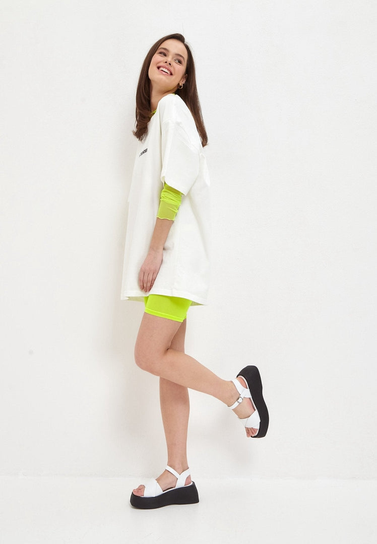 A close-up of stylish white leather platform sandals, perfect for summer outfits and adding a chic touch to any look.
