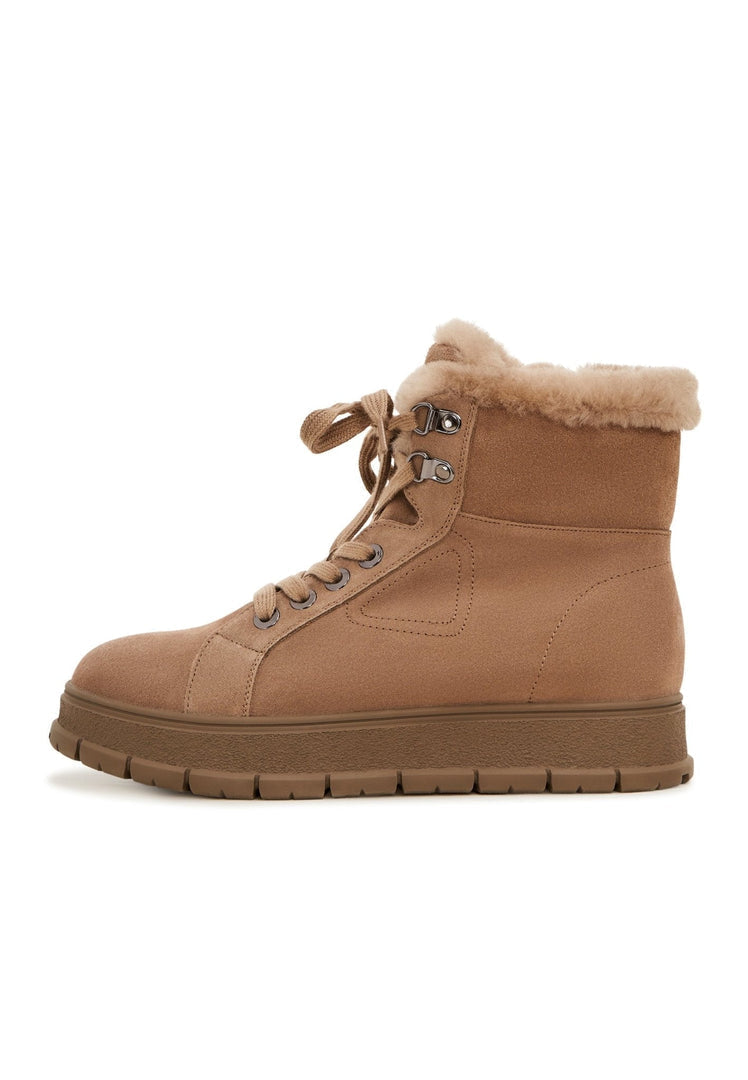 A stylish pair of suede winter boots for men and women, perfect for staying warm and fashionable during the cold season.