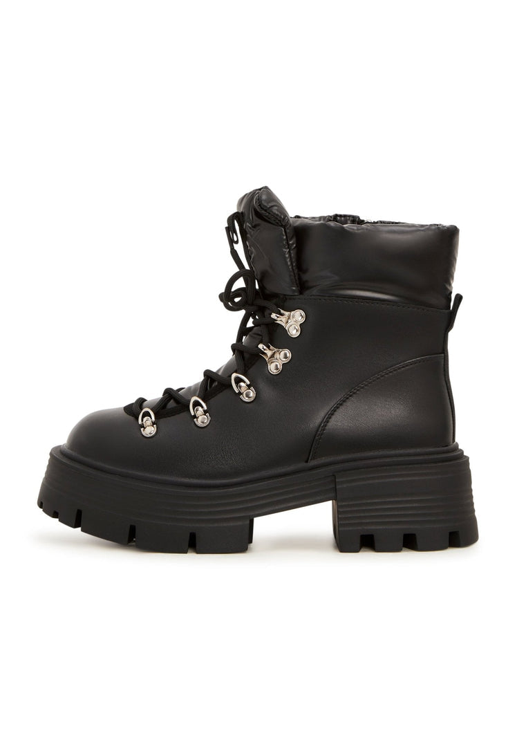 A pair of stylish peep-toe ankle boots, perfect for keeping up with the latest women's shoe trends in summer.