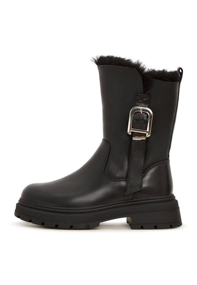 A trendy pair of fashion-forward leather platform ankle boots, the epitome of urban style and fashionable footwear.