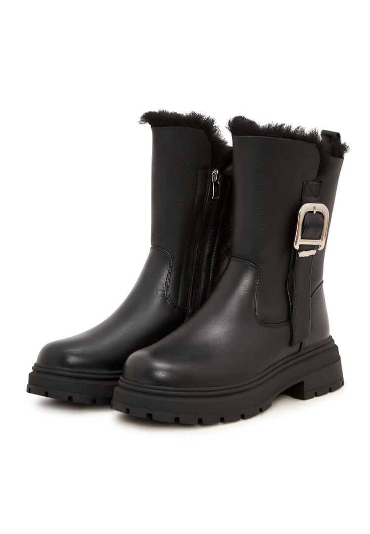 A trendy pair of ankle boots with a platform heel, perfect for urban style fashionistas looking for fashionable leather boots.