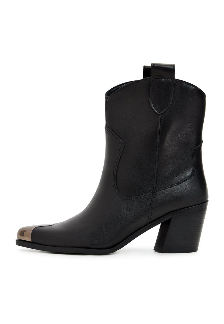 A pair of vintage designer cowboy boots crafted from handmade leather for men.