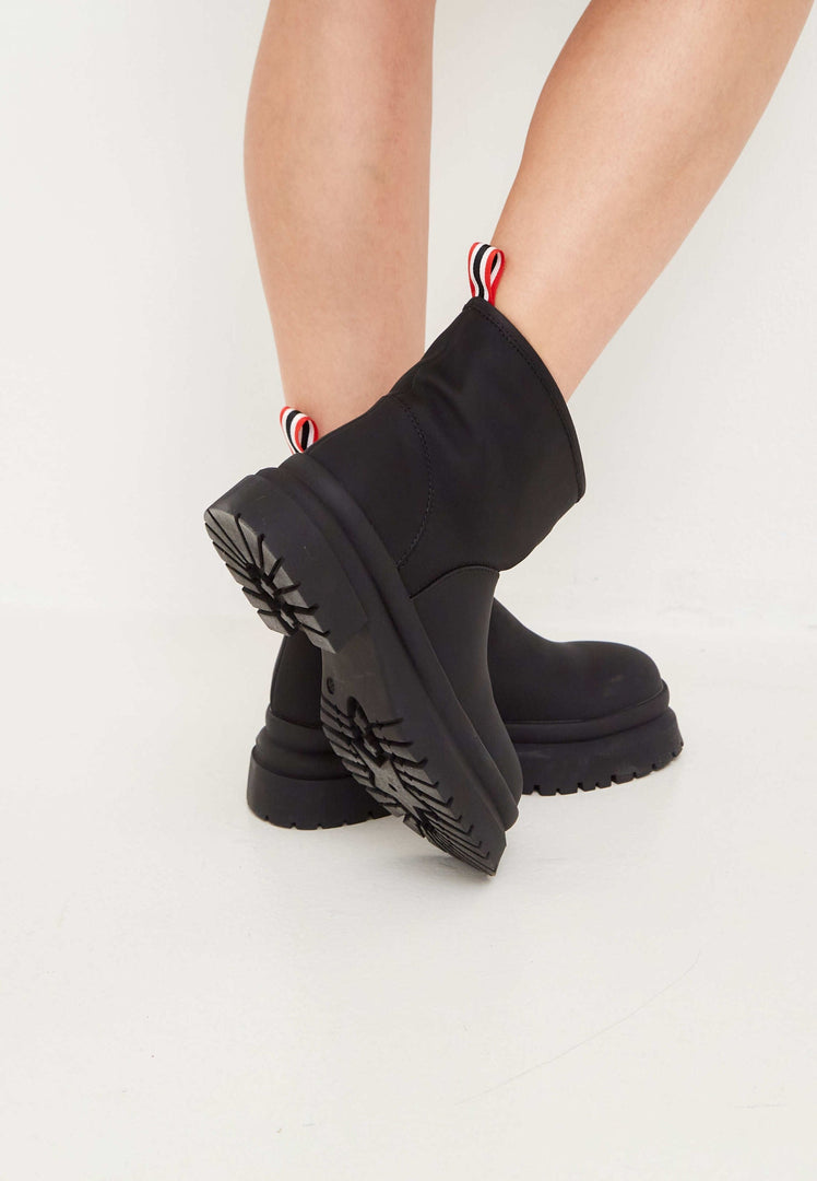 A stylish pair of black pull-on winter boots, the classic choice for winter footwear.