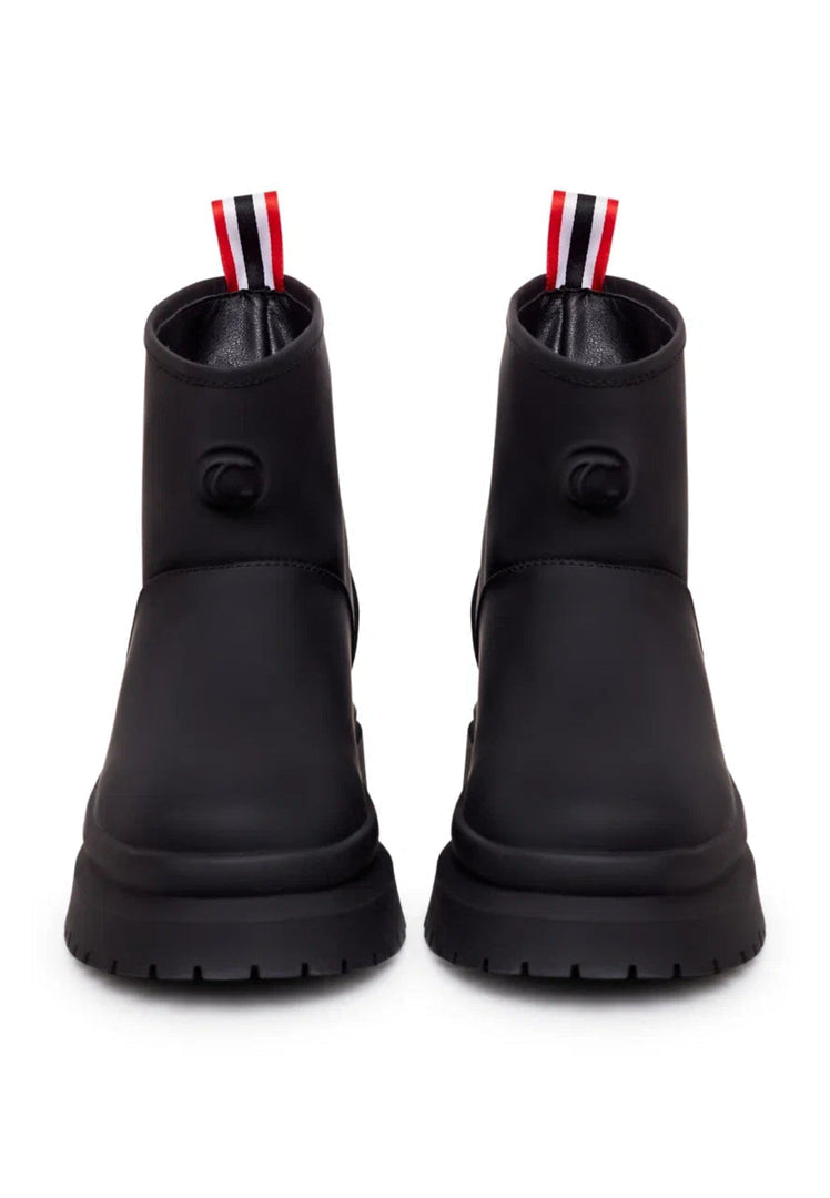 A pair of classic black pull-on winter boots, perfect for the cold season and stylish winter footwear.