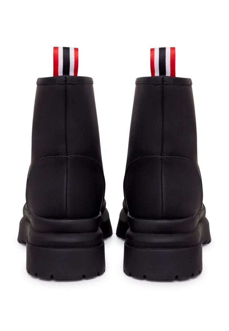 A pair of classic black pull-on winter boots, perfect for cold weather, as essential winter footwear.
