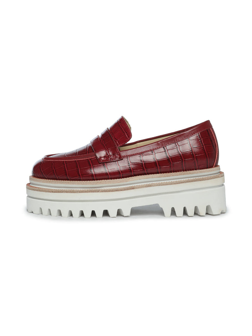 A pair of trendy women's fashion shoes in Bordeaux featuring croc-embossed detailing, perfect for any stylish outfit.