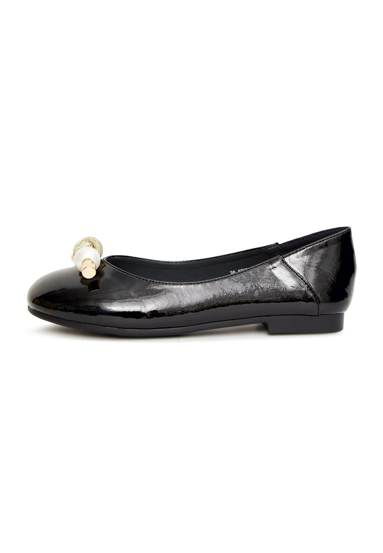 A stylish pair of black flats with pearl embellishments and a charming bow detail, perfect for women who love fashionable footwear.