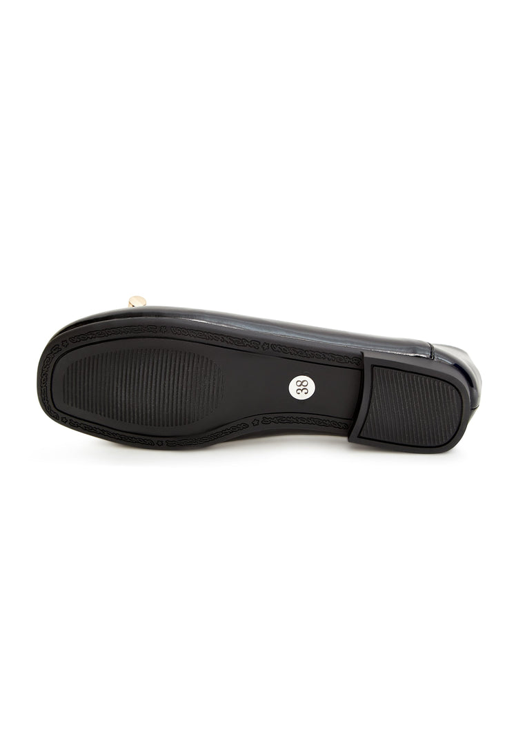 A pair of fashionable black flats with pearl embellishments and a bow detail for women.