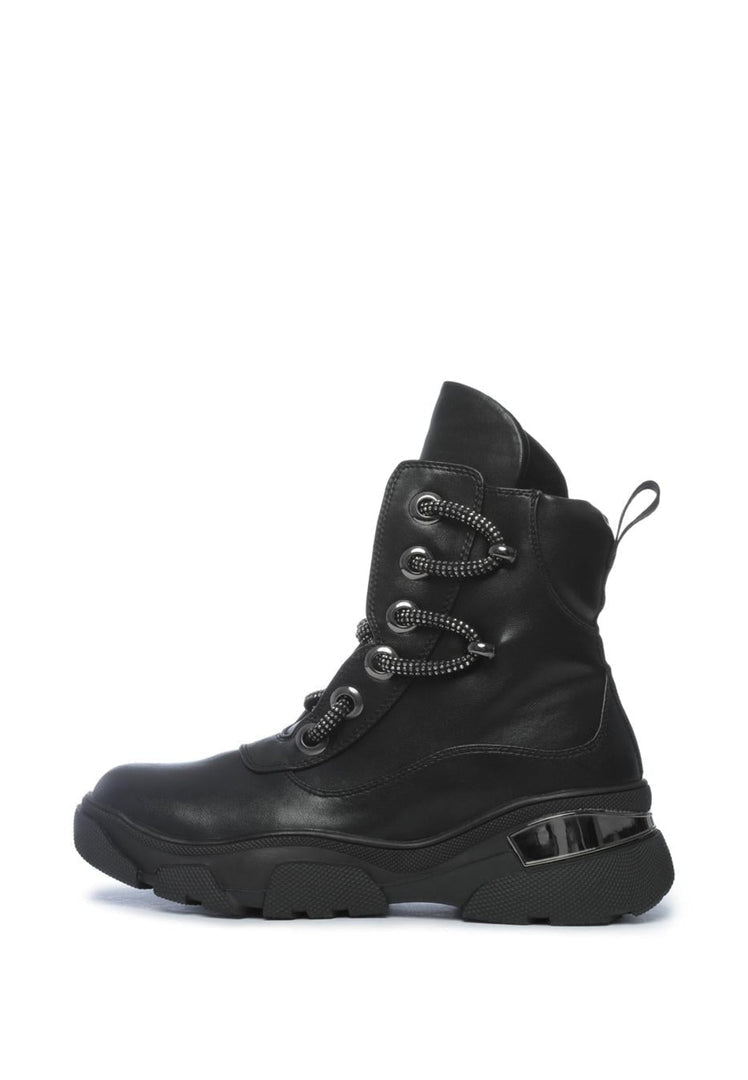 A pair of durable waterproof winter boots, perfect for cold weather conditions. These insulated lace-up boots are ideal for outdoor activities in the snow.