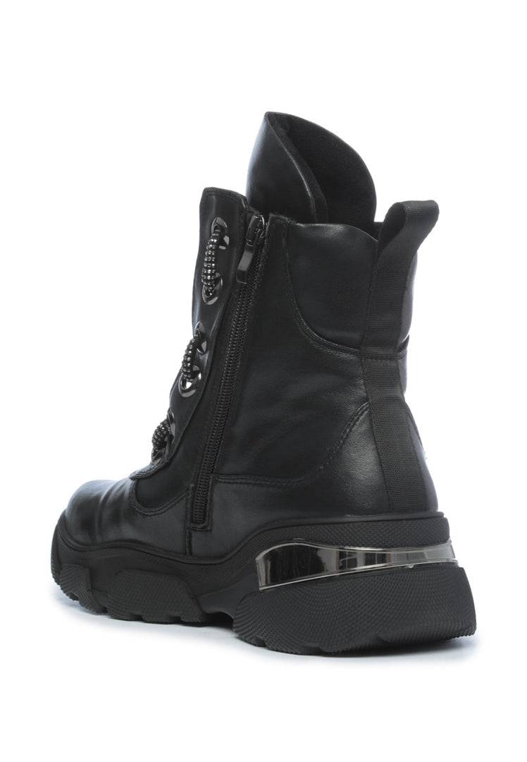 Sturdy and cozy waterproof winter boots with insulation and durable lace-up design, perfect for cold weather outdoor adventures.