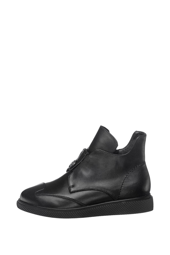 A pair of trendy and stylish black slip-on ankle shoes - perfect for a modern look.