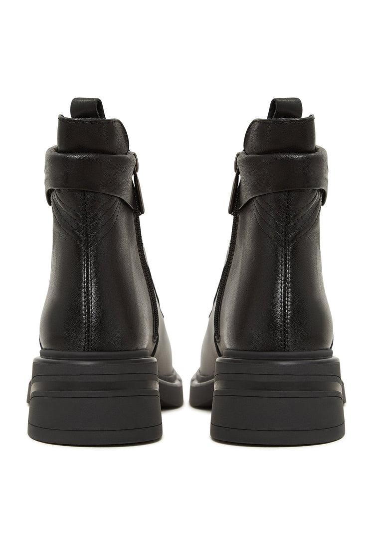 A pair of stylish black ankle boots with a trendy block heel design, perfect for a fashionable look.