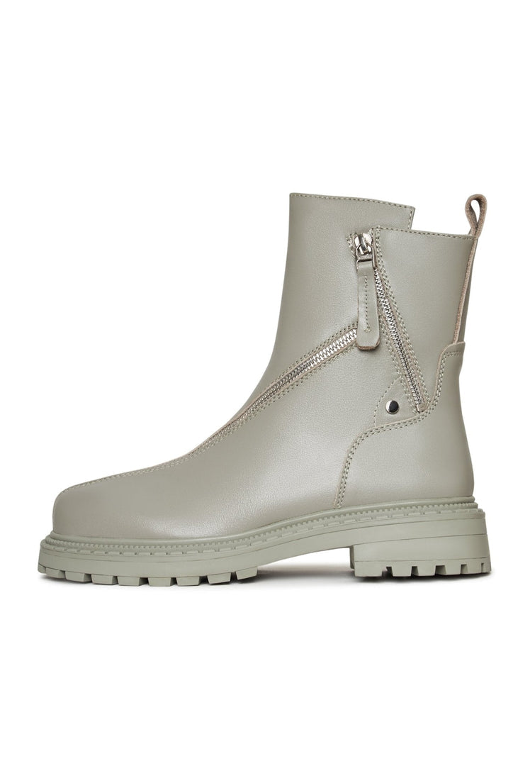 A stylish pair of fashion-forward women's leather ankle boots in green with a platform sole.