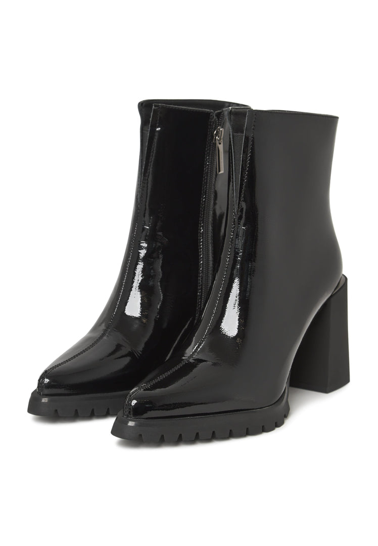 A stylish pair of black patent ankle boots, a classic choice in women's footwear crafted from high-quality leather.